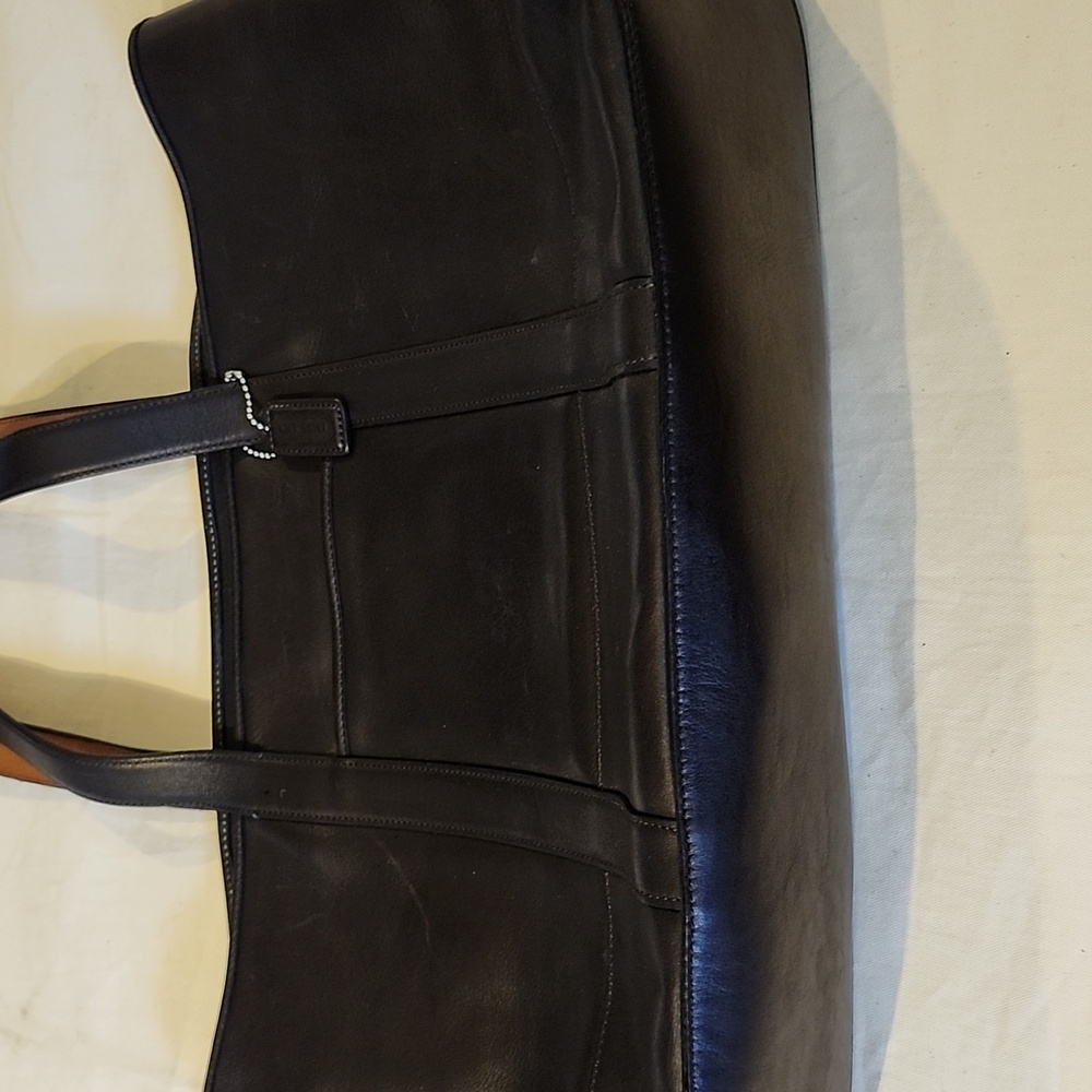 Coach vintage leather brown fabric inside plenty of room to hold laptop